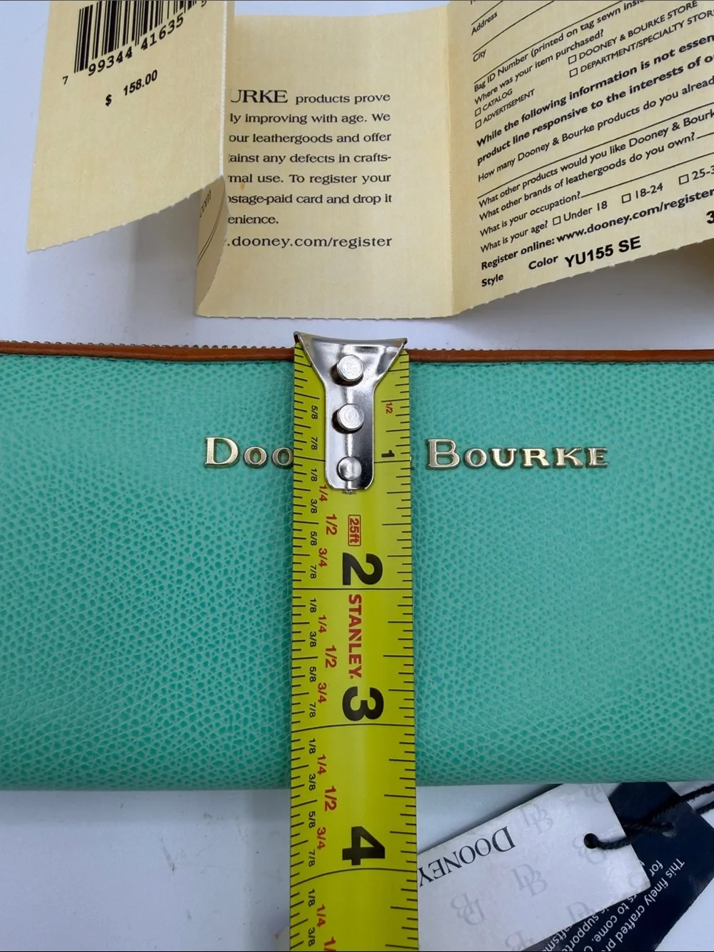 Dooney & Bourke Turquoise Zip-Around Wallet with Tan Trim and Gold Logo